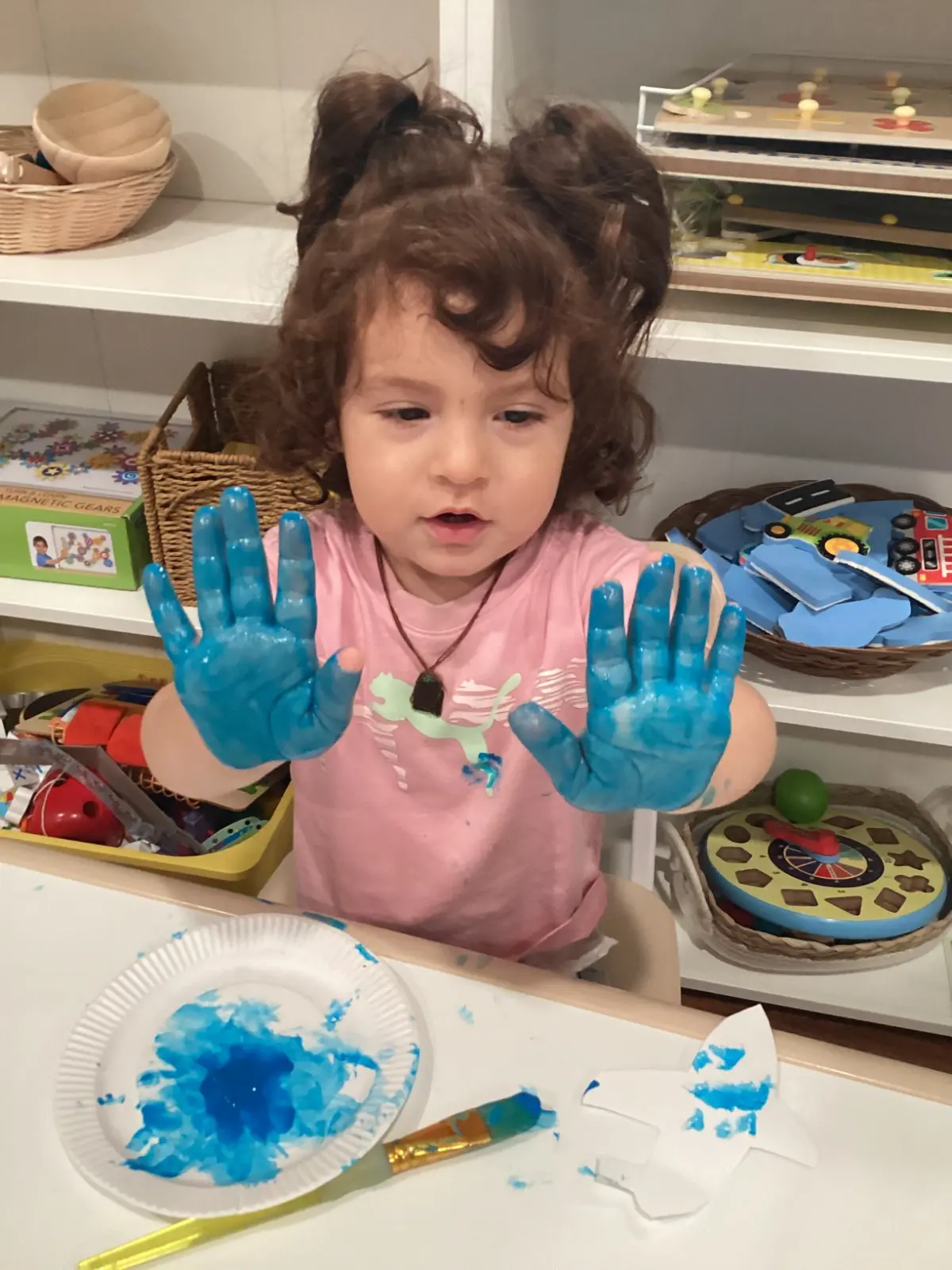 Kid with blue hands